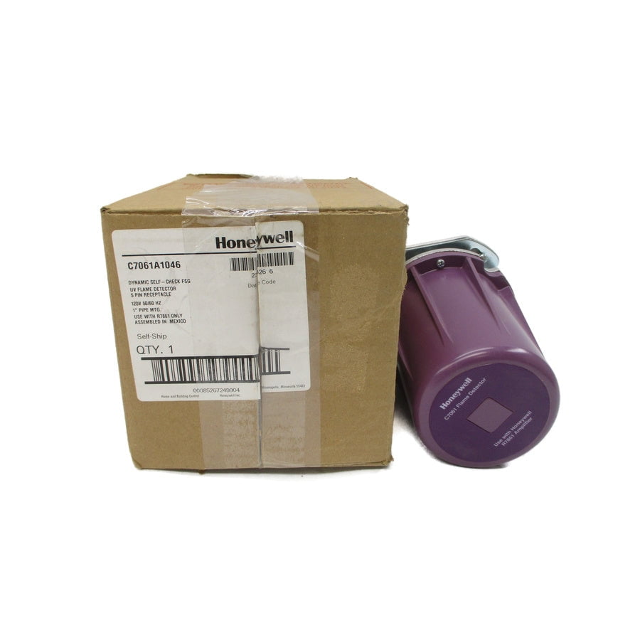 Honeywell C7061A1046 detector beside its labelled packaging